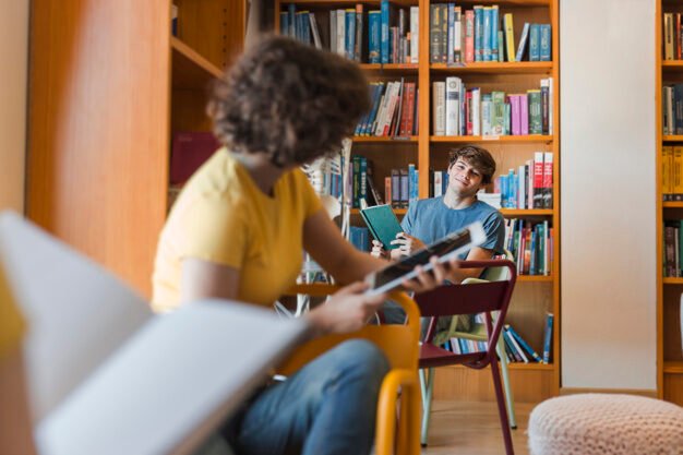 teenagers-looking-each-other-library_23-2147860570